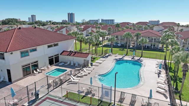 view of swimming pool with a lawn and a patio