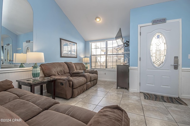 tiled entrance foyer featuring lofted ceiling