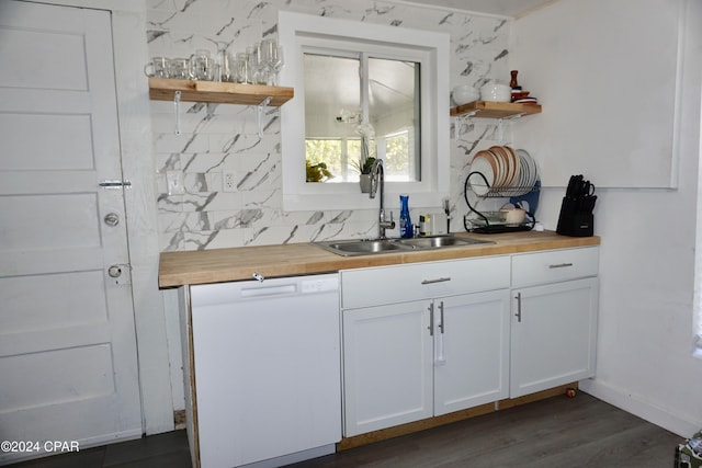 kitchen featuring wooden counters, dark hardwood / wood-style flooring, white cabinets, sink, and dishwasher