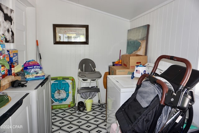 laundry room with washer and clothes dryer and ornamental molding