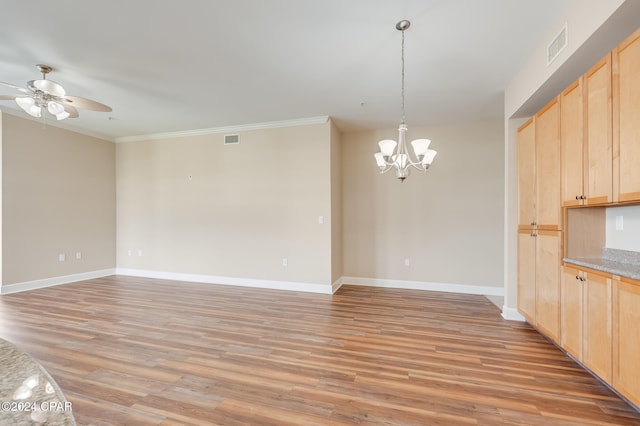 interior space featuring light hardwood / wood-style flooring, ceiling fan with notable chandelier, and ornamental molding