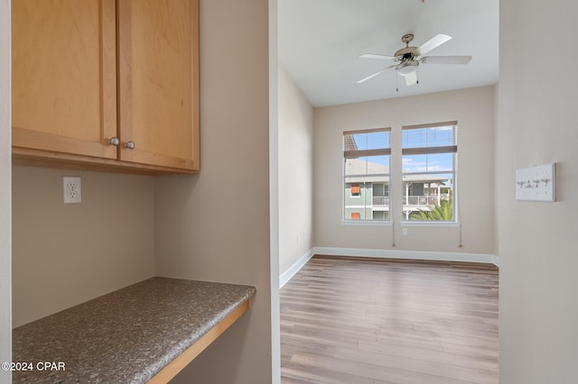 interior space with ceiling fan and light hardwood / wood-style floors