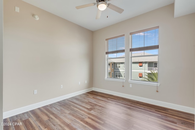 unfurnished room with ceiling fan and light hardwood / wood-style floors