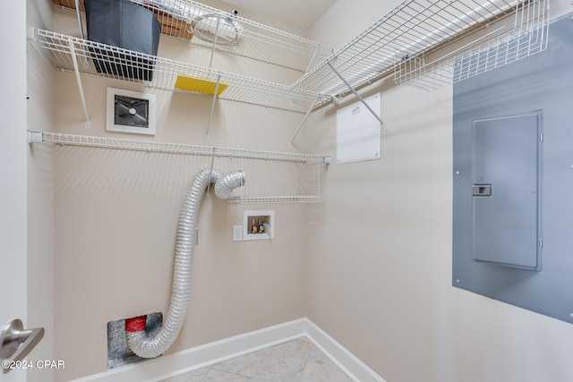 laundry room featuring electric dryer hookup, electric panel, tile patterned floors, and hookup for a washing machine