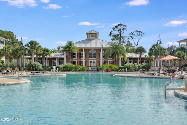 view of swimming pool featuring a patio