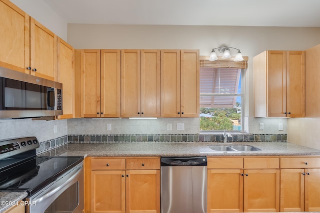 8700 Front Beach Rd Unit 4317, Panama City Beach, FL 32407 - kitchen with appliances with stainless steel finishes, a sink, backsplash, and light brown cabinets