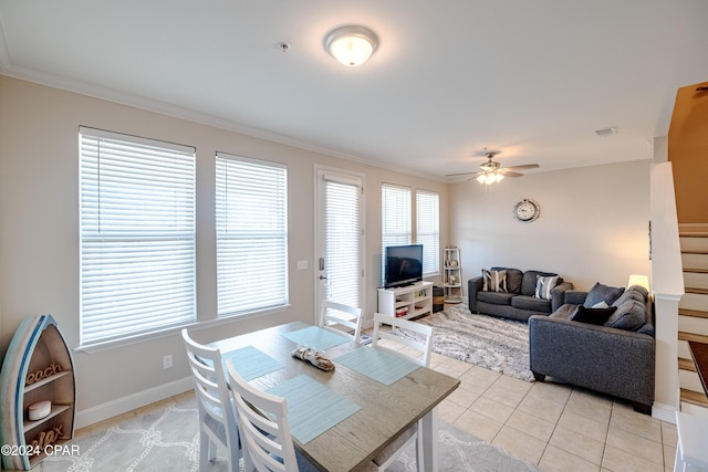 living room featuring ceiling fan, ornamental molding, and light tile patterned floors