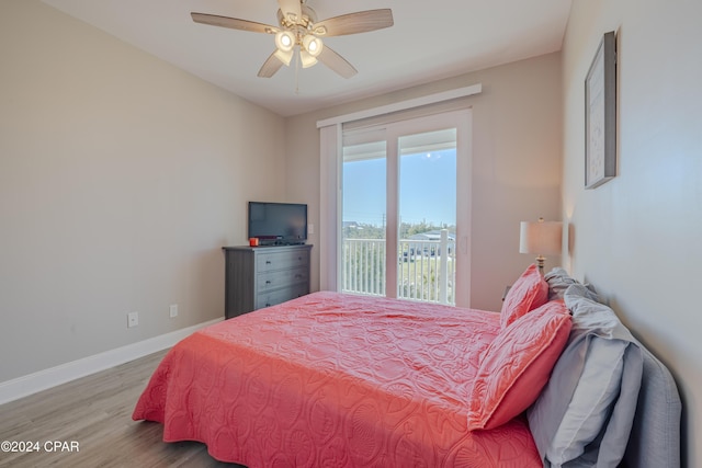 bedroom featuring access to outside, ceiling fan, and light hardwood / wood-style flooring