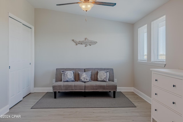 sitting room with vaulted ceiling, light hardwood / wood-style flooring, and ceiling fan