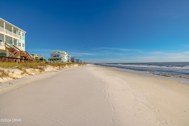 view of street with a view of the beach and a water view