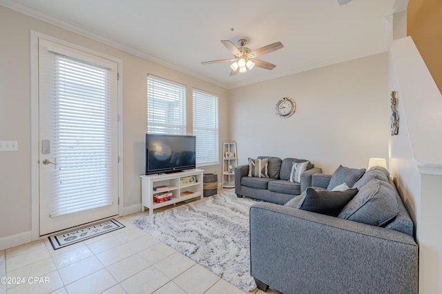 living room with ceiling fan, light tile patterned flooring, and ornamental molding