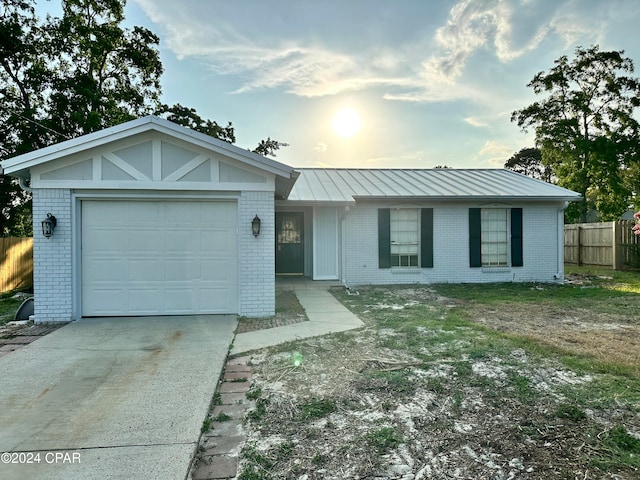 single story home with a garage