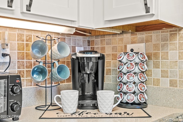 interior details with white cabinets and backsplash