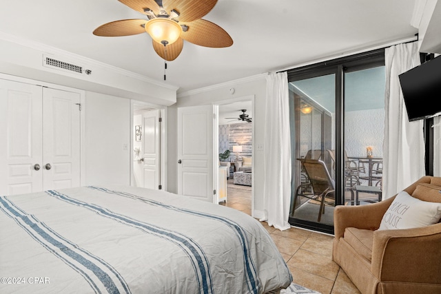 bedroom featuring ceiling fan, access to outside, a closet, light tile patterned floors, and ornamental molding