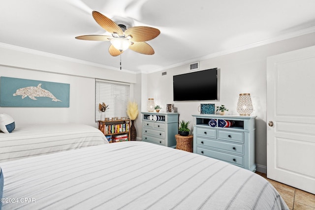 bedroom featuring ceiling fan, ornamental molding, and light tile patterned flooring