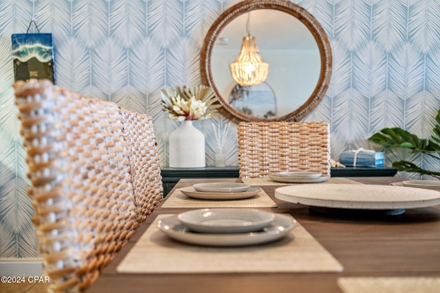 6201 Thomas Dr Unit 1606, Panama City Beach, FL 32408 - dining area view of wallpapered walls and a chandelier