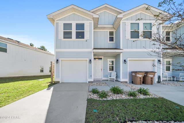 view of front facade with a garage and a front lawn