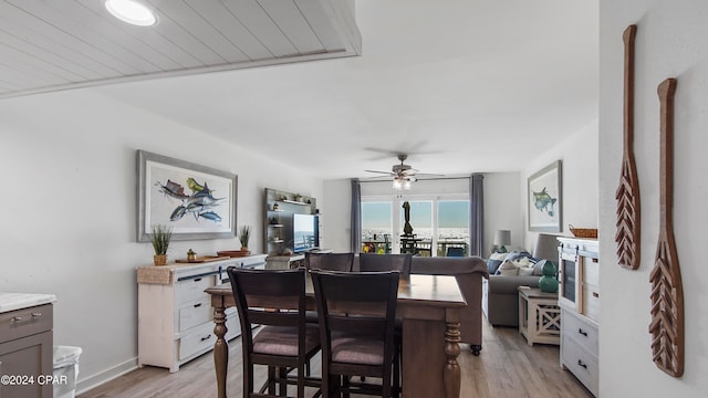 dining space featuring ceiling fan and light hardwood / wood-style floors