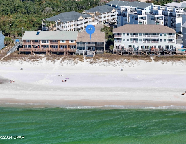 aerial view featuring a water view and a beach view