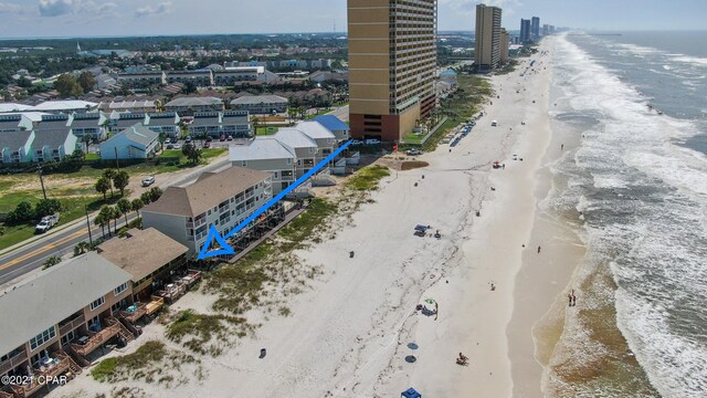 bird's eye view featuring a water view and a view of the beach