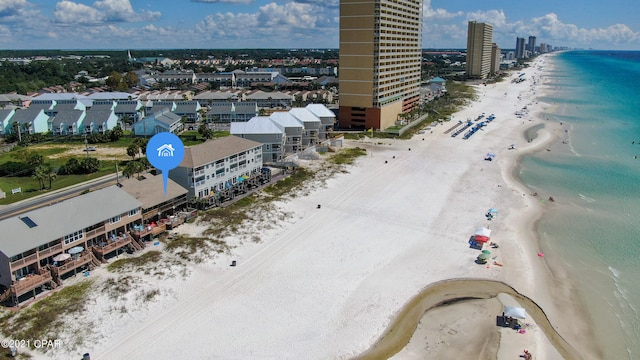 bird's eye view featuring a water view and a view of the beach