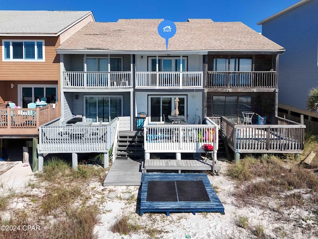 rear view of property with a wooden deck