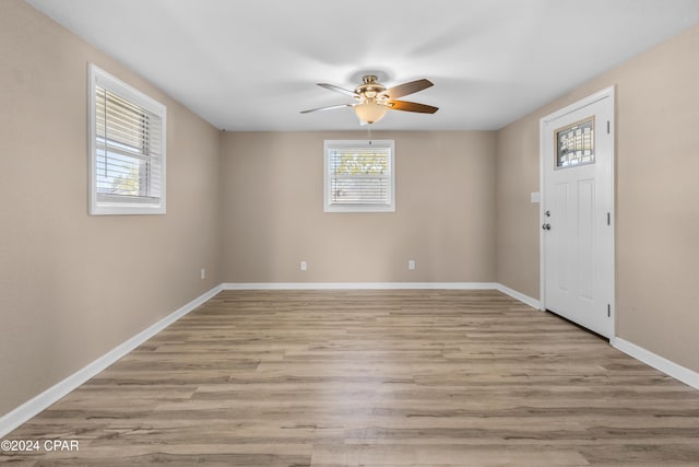 foyer with ceiling fan and light hardwood / wood-style flooring