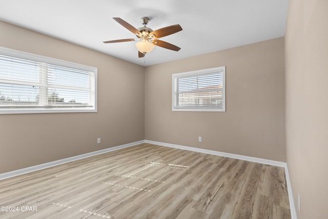 unfurnished room with ceiling fan and light hardwood / wood-style flooring