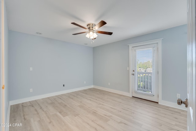 empty room with light wood-type flooring and ceiling fan