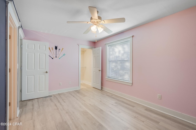 unfurnished bedroom featuring ceiling fan and light wood-type flooring