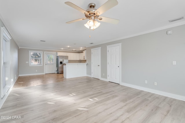 unfurnished living room with light hardwood / wood-style floors, ceiling fan, and ornamental molding