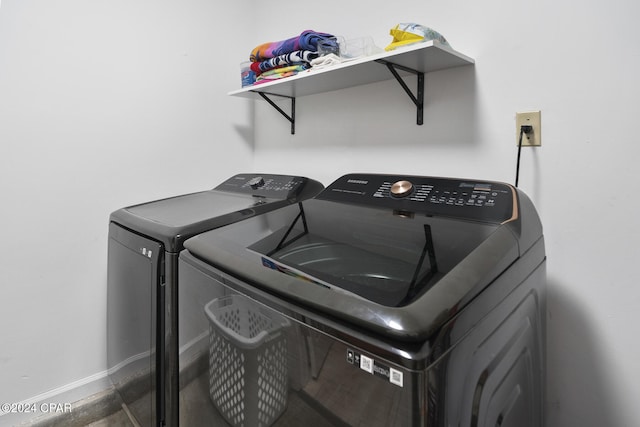 clothes washing area with washer and dryer