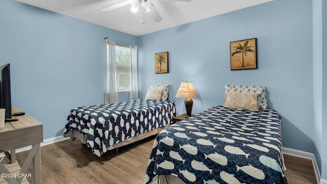 bedroom featuring ceiling fan and wood-type flooring