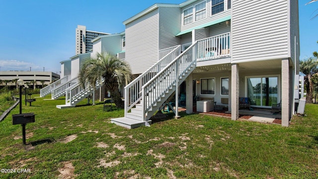 back of house featuring a yard