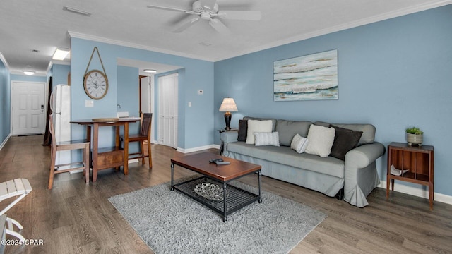 living room featuring hardwood / wood-style flooring, ceiling fan, and ornamental molding