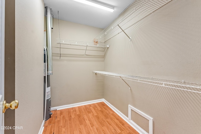 spacious closet featuring wood-type flooring