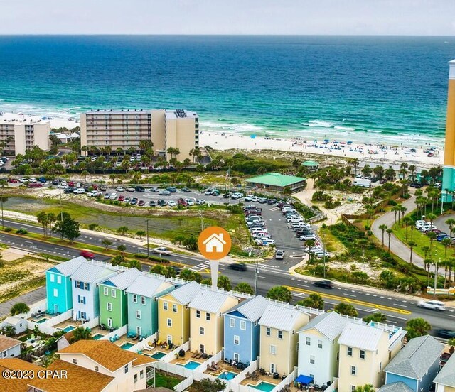 bird's eye view featuring a water view and a view of the beach