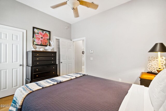 bedroom with hardwood / wood-style floors and ceiling fan