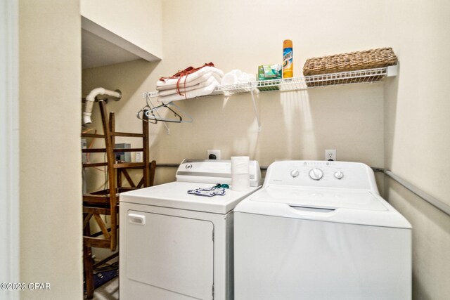 laundry area with washing machine and clothes dryer