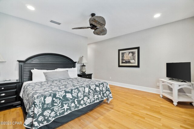 bedroom with wood-type flooring and ceiling fan