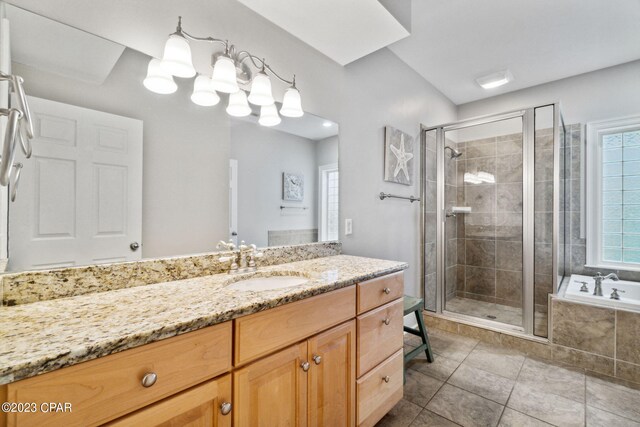 bathroom with tile patterned floors, vanity, and separate shower and tub