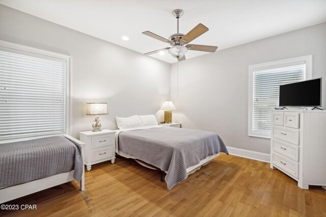 bedroom featuring ceiling fan and light hardwood / wood-style flooring