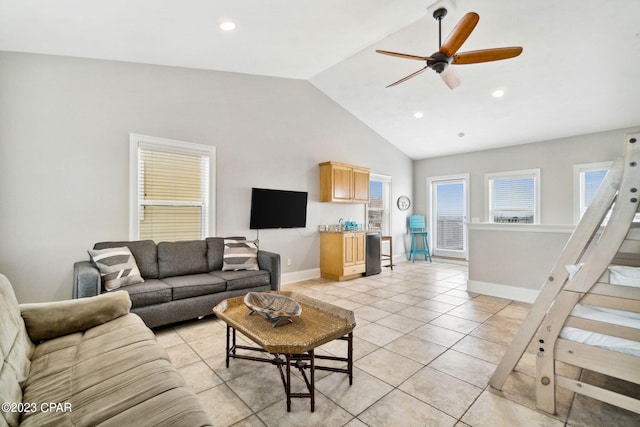 living room with ceiling fan, light tile patterned flooring, and high vaulted ceiling