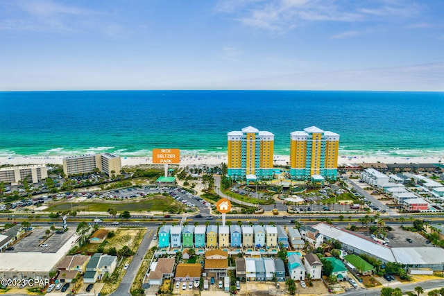 aerial view with a water view and a view of the beach