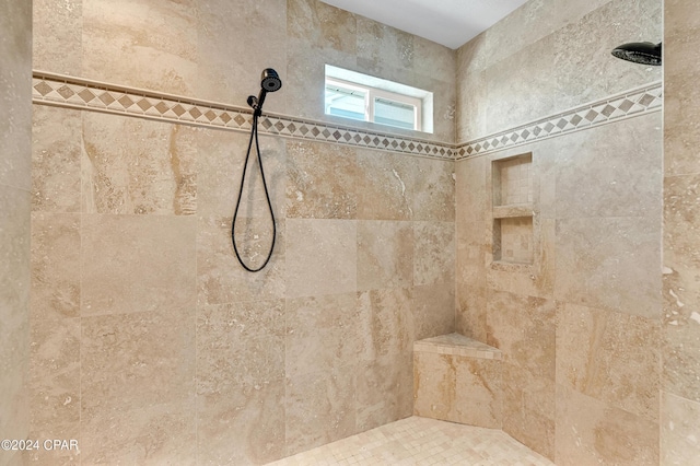 bathroom featuring tiled shower