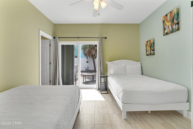 bedroom with access to exterior, light hardwood / wood-style floors, and ceiling fan