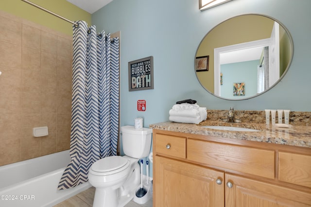 full bathroom featuring tile patterned flooring, shower / bath combination with curtain, vanity, and toilet