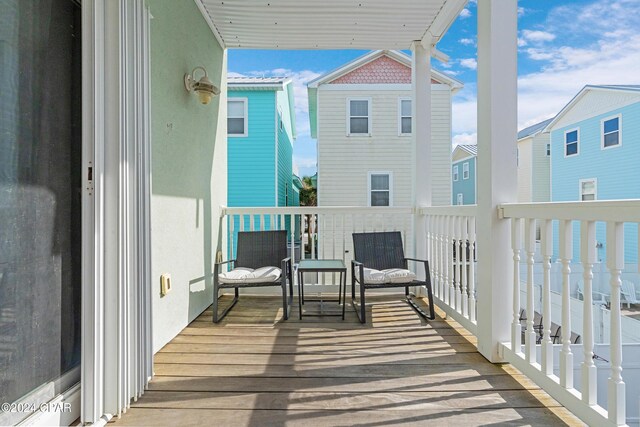 wooden balcony featuring a deck