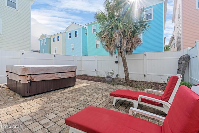 view of patio / terrace with a hot tub