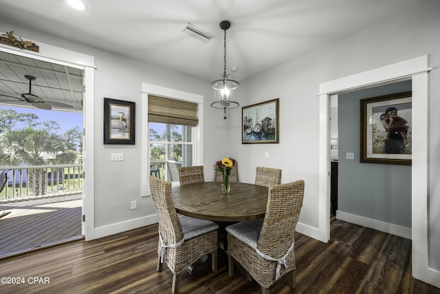 dining area featuring ceiling fan and dark wood-type flooring